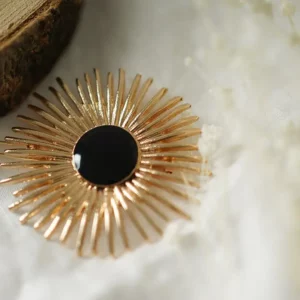 Barrette ronde dorée et pierre noire – Nahara
